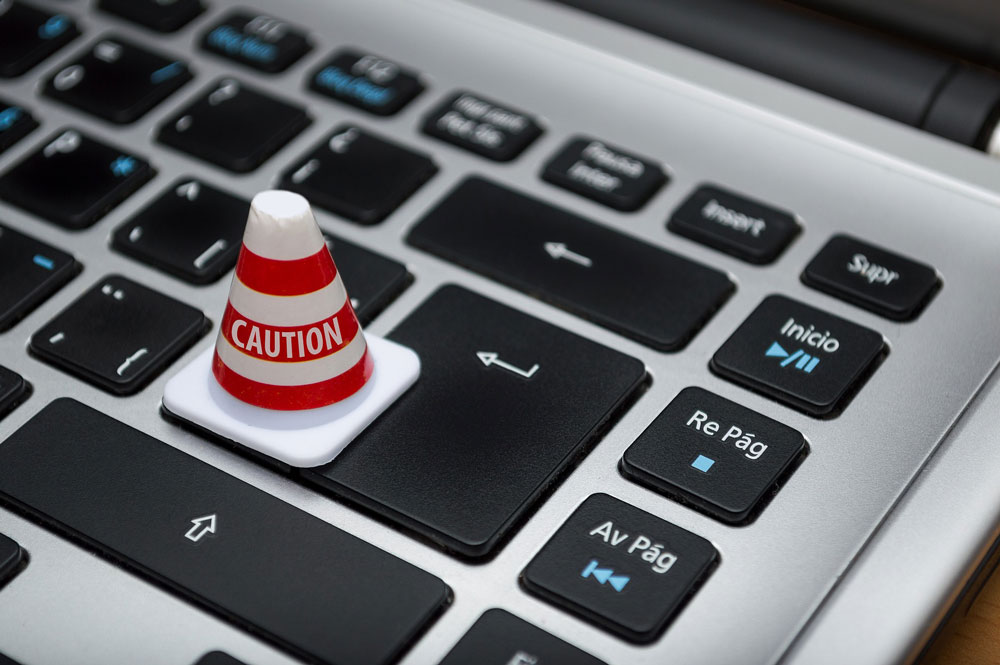 a keyboard with a caution cone on it